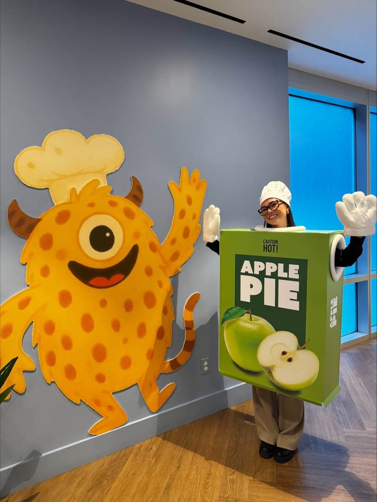CartonCraft apple pie costume character in Ronald McDonald House lobby on Pi Day